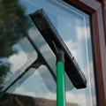 window glass cleaning with Caraselle Rubber brush